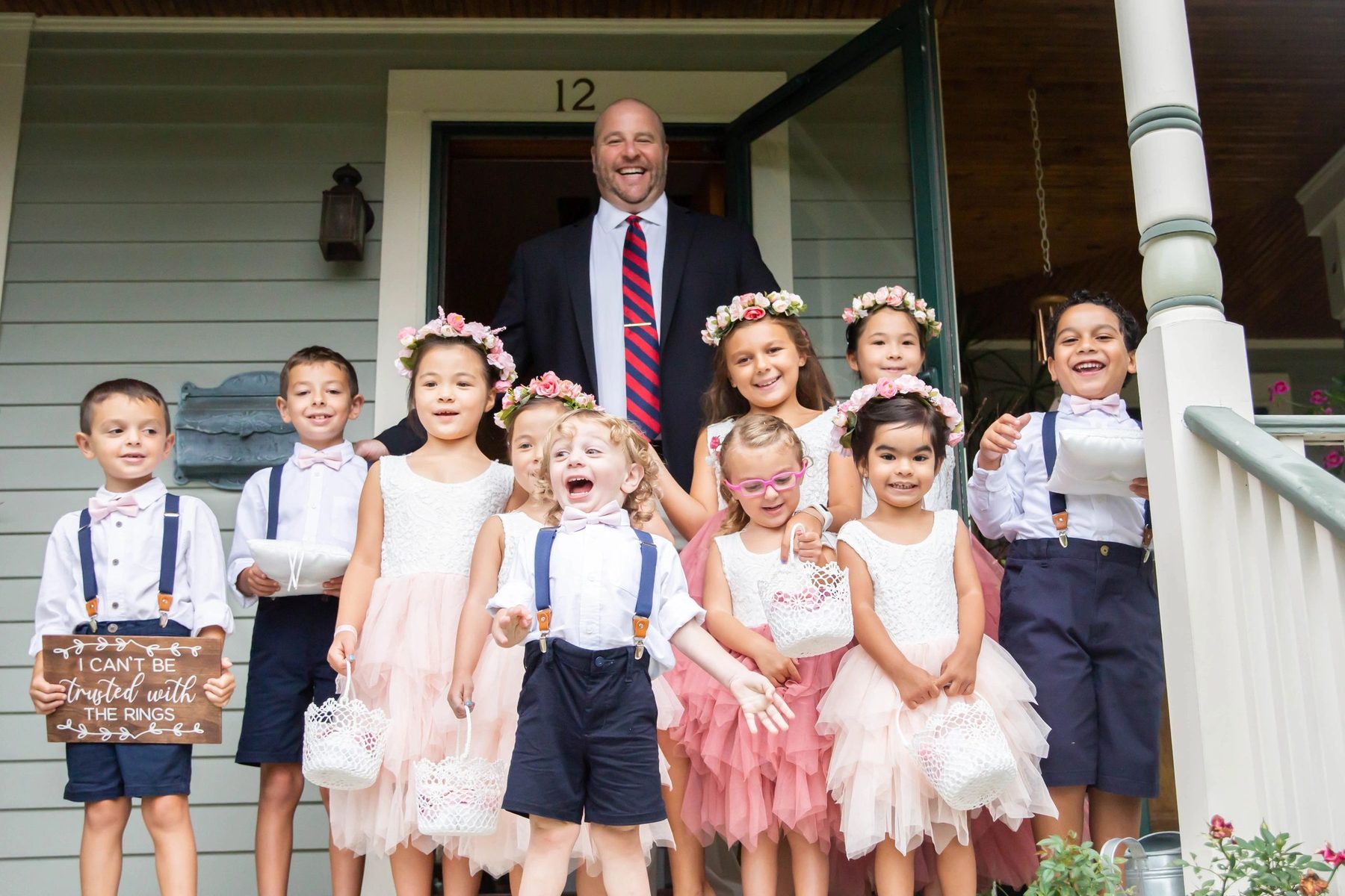 Jim grinning with the flower girls and ring bearers