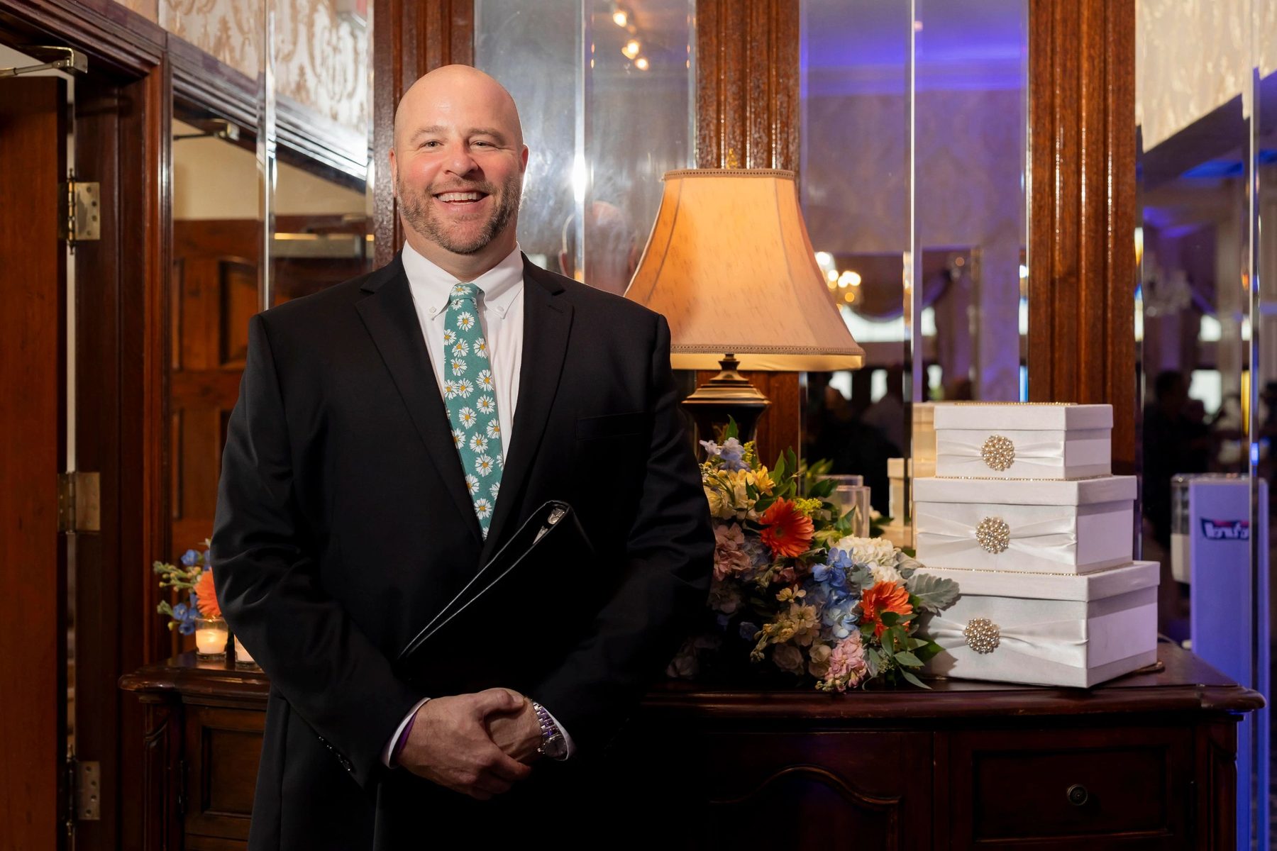 Jim Hill smiling at a wedding venue