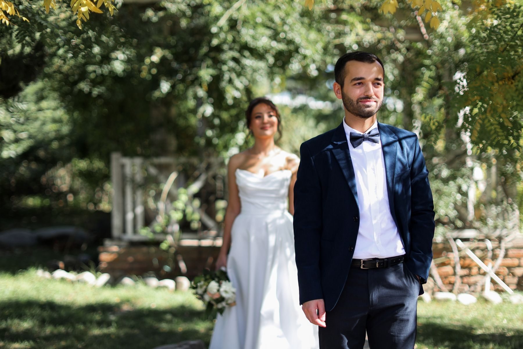 A couple smiling together in a garden