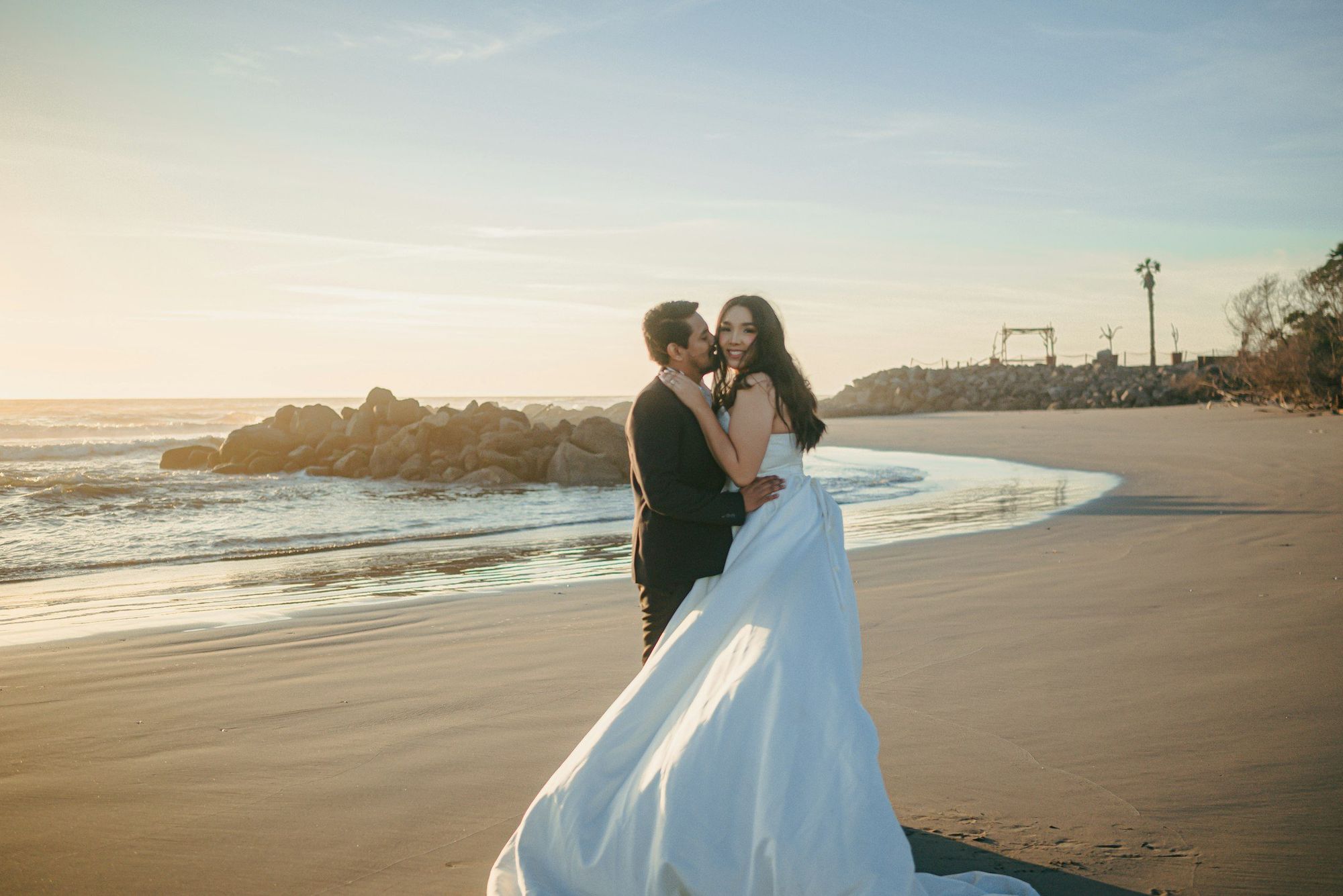 A couple embracing on a sunny beach